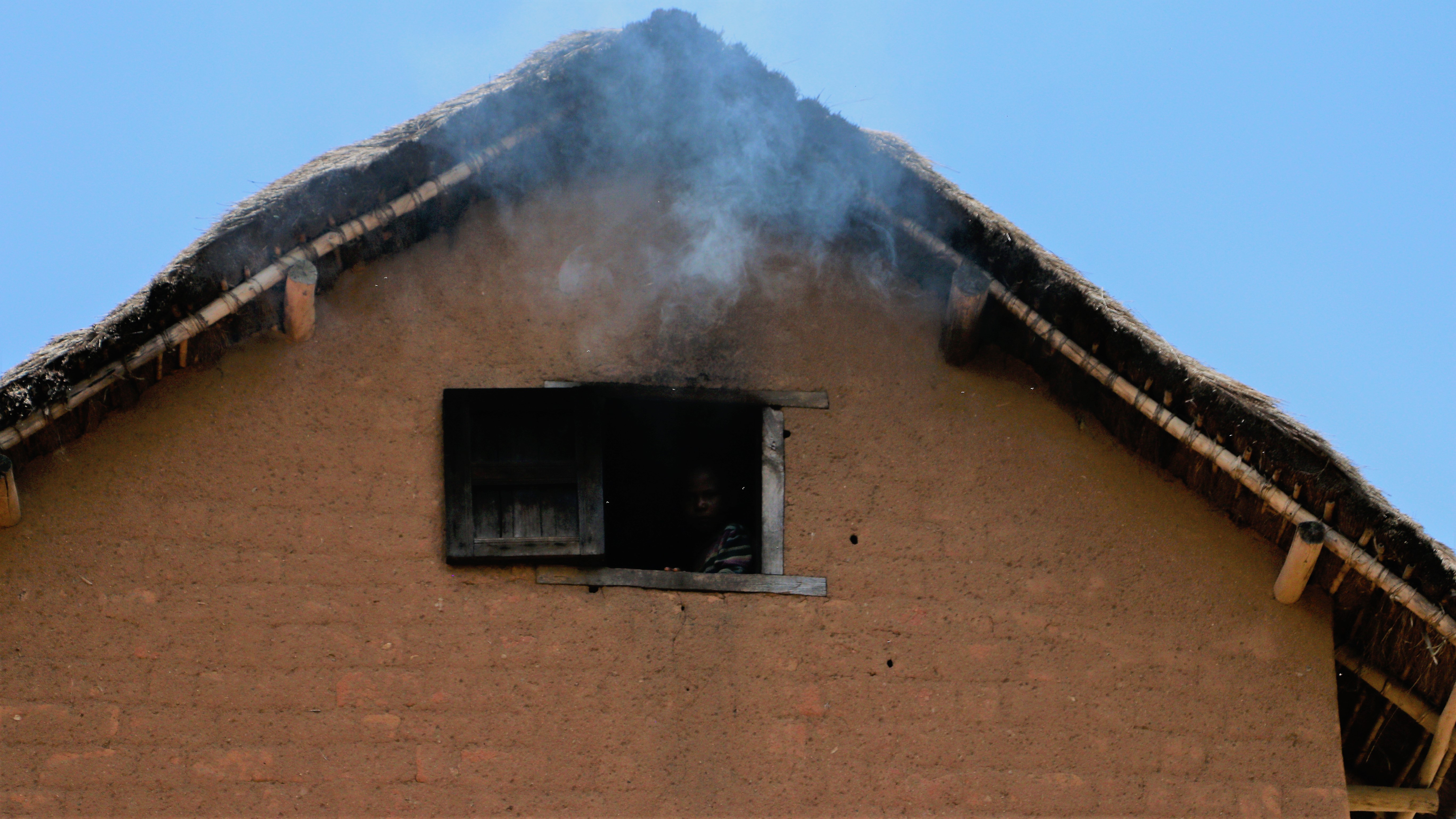 Smoke generated from firewood, from the inside of a house in Fianarantsoa. A photo that best demonstrates the real indoor household pollution issue in Madagascar. The kid looking out of the window seems to be so used to this smoke.